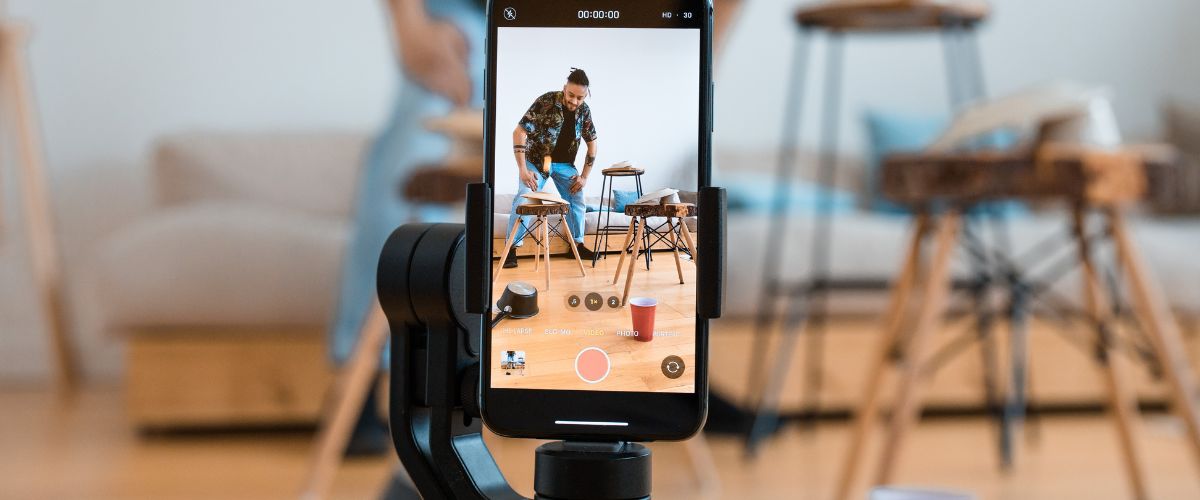 a group of dancers are video recording themselves on a mobile phone