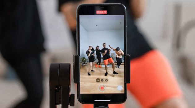 A person video shooting himself on his mobile